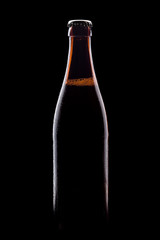 brown bottle of beer, clipping path,on a black background, with brilliant edges and foam