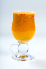 Tea with sea buckthorn on white background