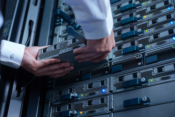 Blade server being held by an experienced engineer