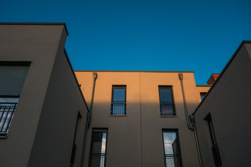Fototapeta na wymiar modern architecture in darken colors with copy space in the sky