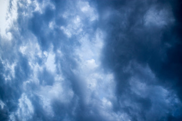 Beautiful clouds at sunset after rain as background .