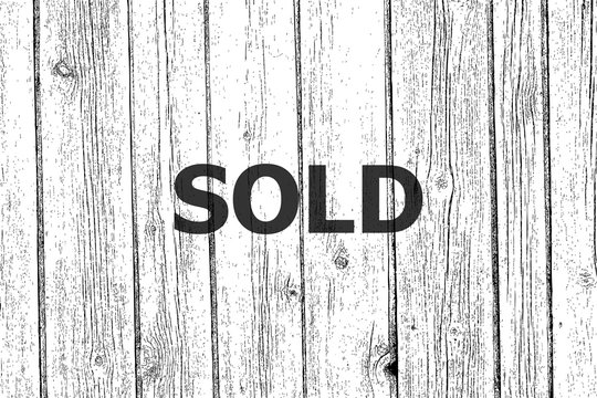 Text Sold. Business concept . Wooden texture background. Black and white
