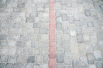 Gray brick on ground for street. close up