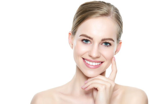 Beautiful young blond smiling woman with clean skin, natural make-up and perfect white teeth white background