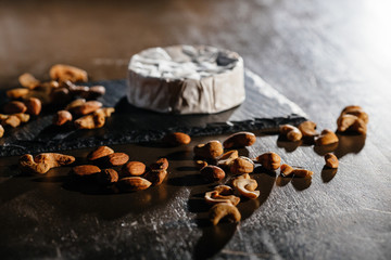 Cheese with nuts on table