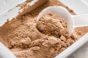 protein powder for fitness nutrition to start training stone background