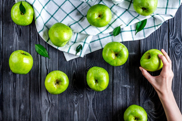 Organic fruits with green apples mock up on dark background top view