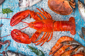 Fresh tasty seafood served on old wooden table.