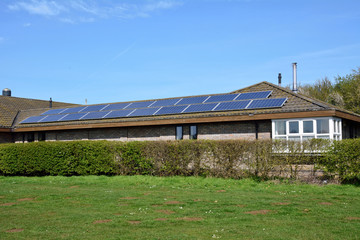 Fototapeta na wymiar Solar panels of roof of building