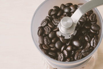 Coffee beans in coffee grinder