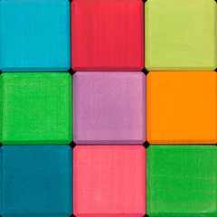Fototapeta premium Wooden color cubes background. Colorful wooden texture