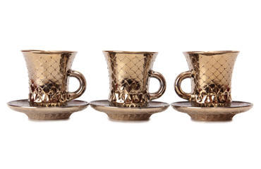 Ancient porcelain tea cups on a white background