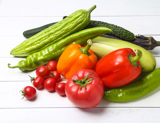 various colorful vegetables on white wooden table