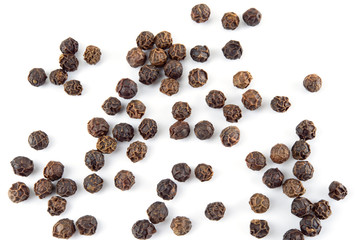 Peppercorn isolated on white background. Dry black pepper seeds. Top view.