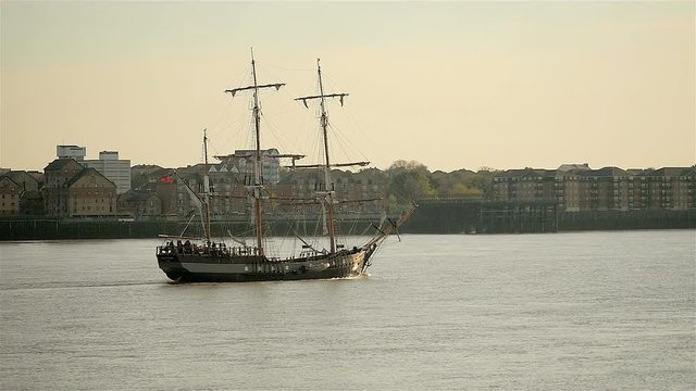 Traditional old sailing ship sailing past Gravesend on the River Thames; slow motion