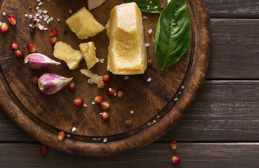 Cheese delikatessen closeup on rustic wood, brie and parmesan