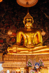 giant buddha in one of the temples in bangkok in lotus pose