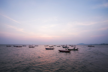 Obraz premium Sea locals fishing boats at sunset