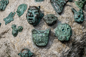 Metal Mask on Rock,Japan.