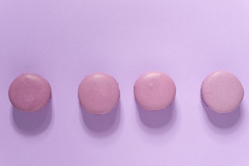 Four sweet purple macaroons