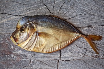 smoked fish on the wooden table, vomer