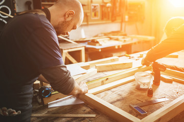 professional carpenter working in the workshop