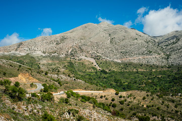 Fototapeta na wymiar Greece, Crete, view to the green hills and grey tops