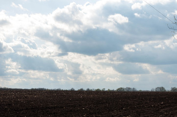 field. rural landscape. cloudy skies. inwardness