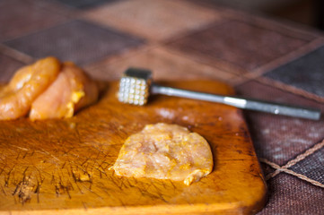 Cooking homemade chicken chops with raw meat and curry spices close up
