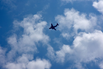 Fototapeta na wymiar 飛行機と青空と雲「空想・雲のモンスターたち」（未来、旅立ち、力強い、躍進、未来などのイメージ）