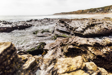 Rocks overlooking beach shoreline.

