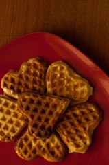 baked waffles in plate on white background