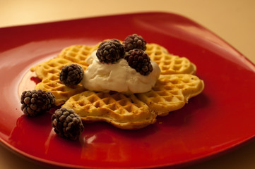 Belgian waffles with berries (currants, strawberries) and ice cream