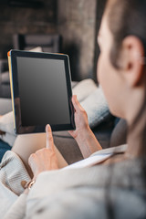 cropped shot of woman pointing on blank screen of digital tablet