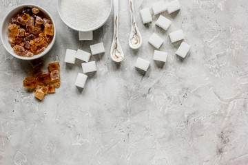 cooking sweets set with different sugar lumps on gray table background top view mockup