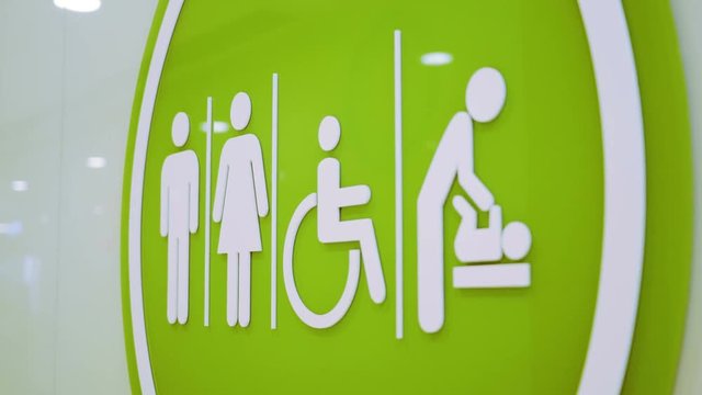 Restroom and Toilet Access Sign. Sign of toilet or restroom access for baby caring parents, disable people, male and female. 4K tile up shot.