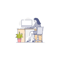 Young woman sits and works on computer
