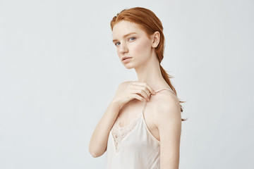 Fototapeta premium Portrait of beautiful redhead girl posing looking at camera.
