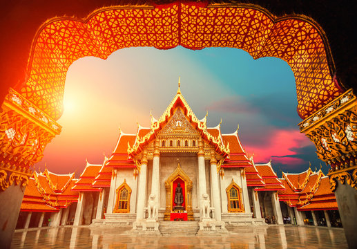 The Marble Temple, Wat Benchamabopit Dusitvanaram with sunset sky in Bangkok, Thailand.