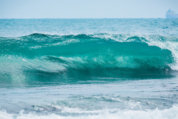 Naklejka na ściany i meble Wave barrel crashing and clear water. Blue wave in tropical ocean. 