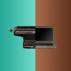 Very old fashion typewriter and laptop