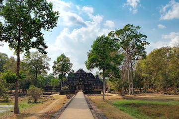 Fototapeta na wymiar Baphuon Temple in Angkor Complex, Siem Reap, Cambodia. It is three-tiered temple mountain and dedicated to the Hindu God Shiva. Ancient Khmer architecture and famous Cambodian landmark, World Heritage