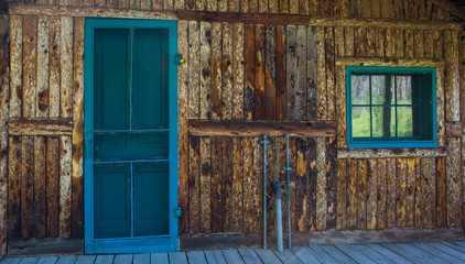 Blue Door And Window On Rustic Cabin