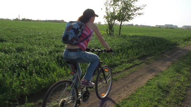 Young woman on a bicycle. Sports girl on a bicycle. Healthy lifestyle.