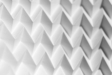 Closeup abstract white folded origami geometrical jigsaw paper pattern background