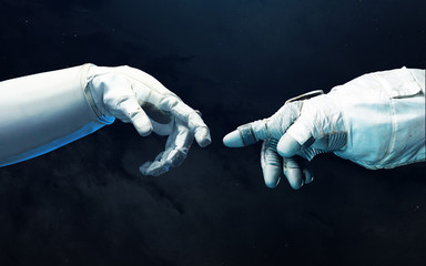 Astronaut hands with background of deep space. Elements of this image furnished by NASA