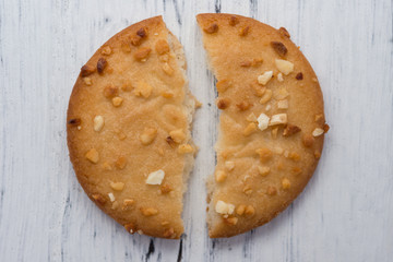 top view broken crispy cracker on white wood