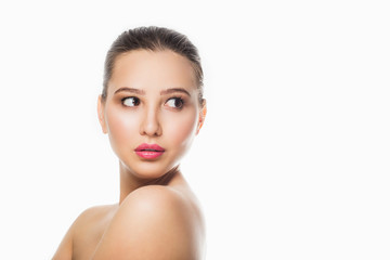 Naklejka premium Beauty Spa Woman with perfect skin Portrait. Beautiful Brunette Spa Girl showing empty copy space on the open hand palm for text. Proposing a product. Gestures for advertisement. Beige background