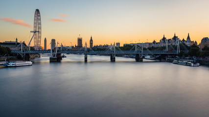 View of Westminster Parliament and London Eye with the river Thames in the foreground