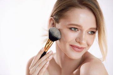 Beauty Face. Portrait Woman With Natural Makeup Applying Powder